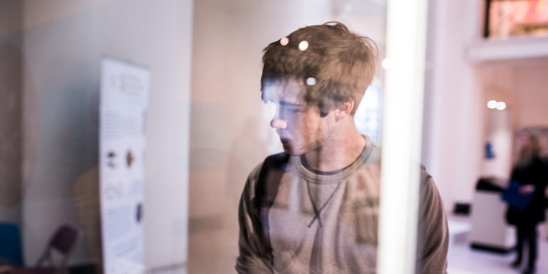 A student looking at art